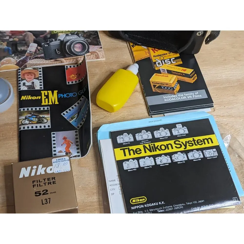 Nikon EM Black body 50mm Series E + Auto Tele Converter + Bag + Kalimar Light +